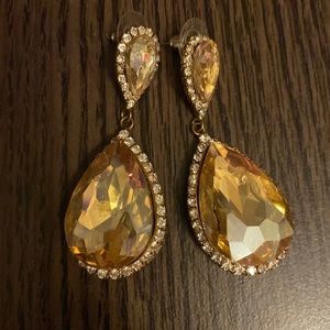 Gold pageant earrings.